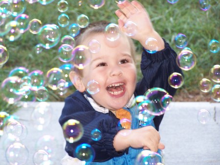 Kegan playing with bubbles.