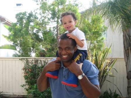 Brenden and Dad hanging out in the backyard.