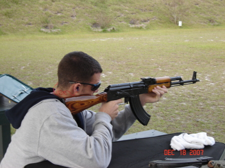 Dad teaching  Jay - The Youngest how to handle a Rifle