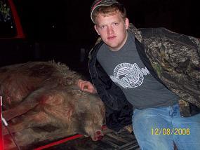 DANIEL AND ONE OF HIS MANY HOGS