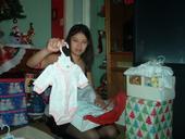 My daughter opening her daughters Christmas gifts