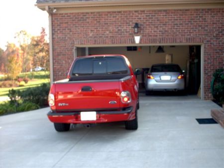 my 2003 toy, ford lightning truck 2007 civic is in background, it gets 40 mpg ahhhhhhhhhh