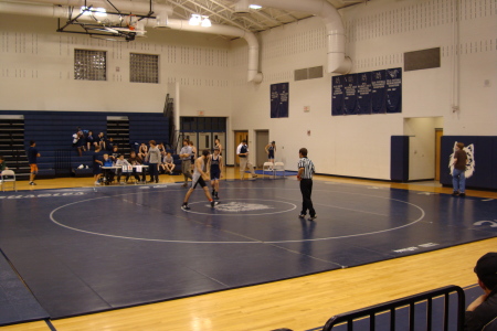 Logan Rodeffer in Gray Wrestling Suit