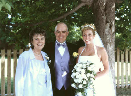 LeeAnn, our youngest, with her mom and dad on her wedding day.