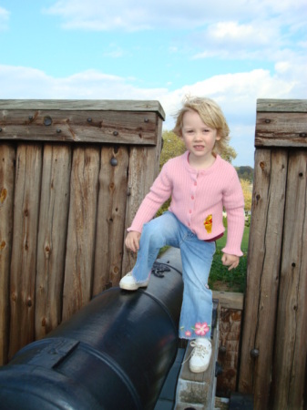 Megan atop a cannon -- Fort George, Niagara on the Lake, Canada