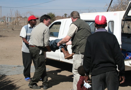 Transporting Sick Young Man to Hospital in South Africa