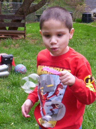 Noah blowing bubbles