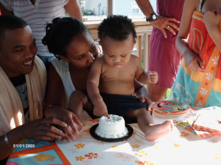 my daughter Monique and my grandson lil ray and big ray on lil rays first birthday