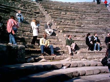 Taking a break at the Small Theater in the ancient ruins of Pompeii.