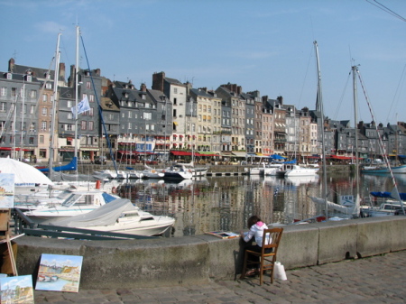 Olivia painting the harbor in Honfleur, France