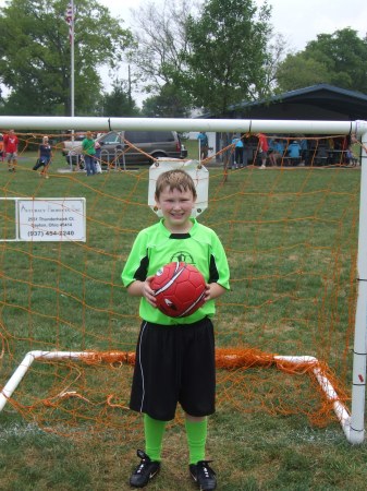 Bailey playing   soccer (lime green wildcats )