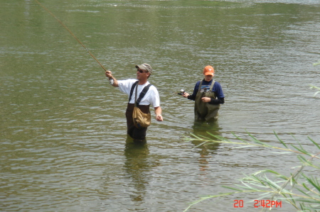 Husband and daughter fly fishing