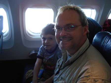 Dad and Noah on plane to WA.