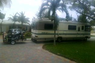 32' motor home & Triumph Rocket III Touring in tow.