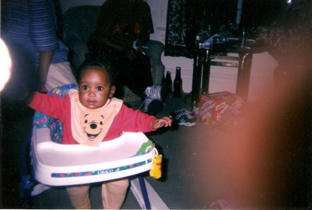 In my walker trying to get into everything. I am Ma'Kayla at the age of 6 months.