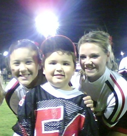 My Boy At a Recent THS Football game wearing my old jersey with the cheerleaders