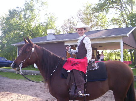 mac doing what she loves...riding sadie!