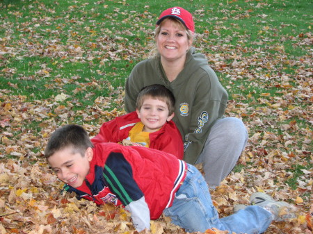 Family playing in leaves