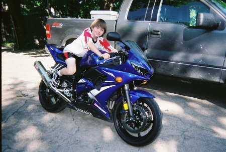 My grandson--wishing he could ride dad's bike