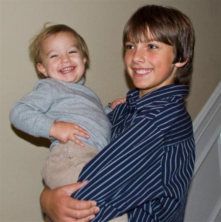 Grandson Julian holds brother, Oliver