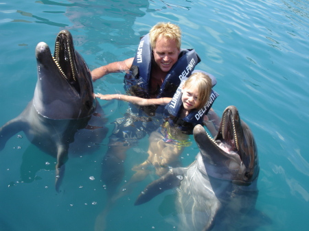 Dave and Ava swimming with the Dolphins