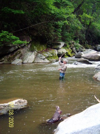 Dick fly fishing for trout on the Rocky Broad