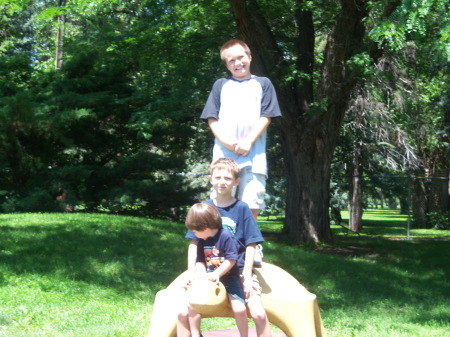 my oldest son tyler is standing on the rock