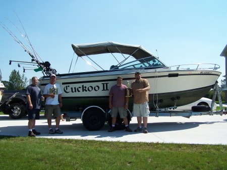 MY HUSBAND 2ND FROM RT AND HIS BOAT