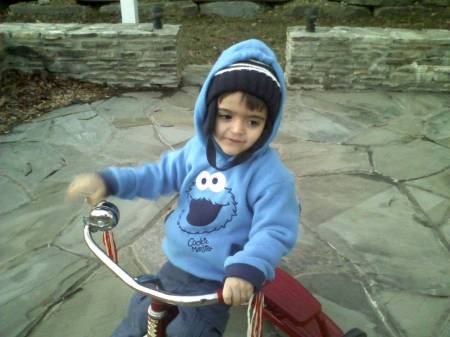 Ryan riding his tricycle
