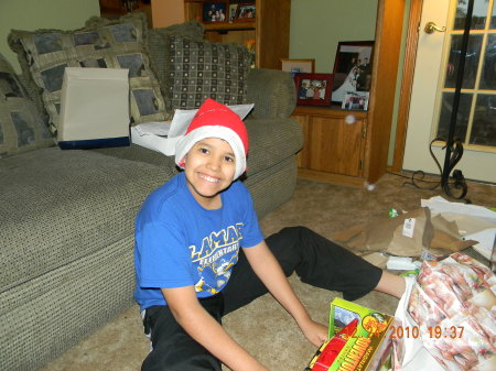 My son Carlos opening up his gifts.