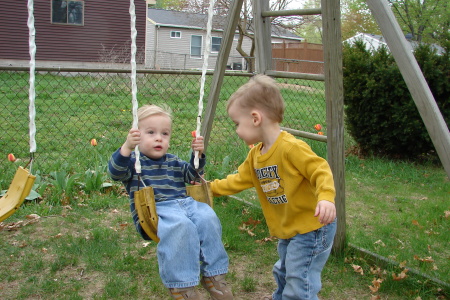 Jack giving Jon a push on the swing