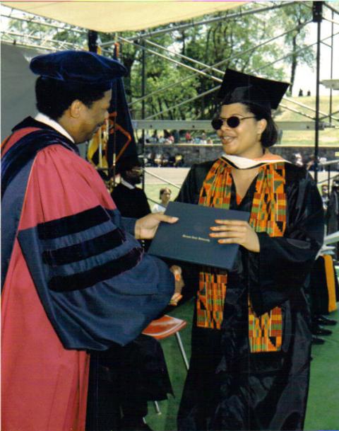 Tobi receiving diploma from Dean