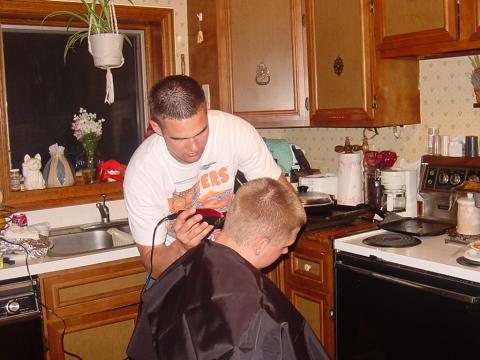 Todd cuts Ken's hair