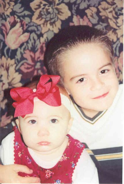 Logan with his baby sister