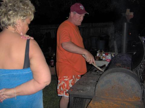 Lonnie flipping the burgers