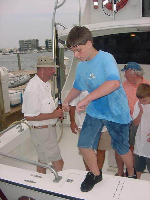 Josh stepping off the fishing boat.