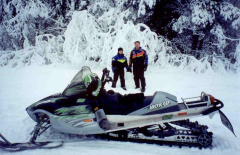 Marilyn & Pierre snowmobile South Canol