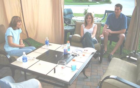 Mom, Anna & Kev relaxing out on the patio