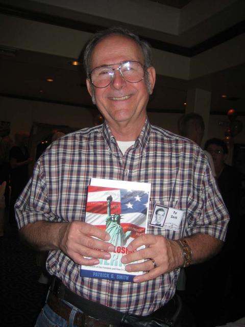 Pat Smith with his book