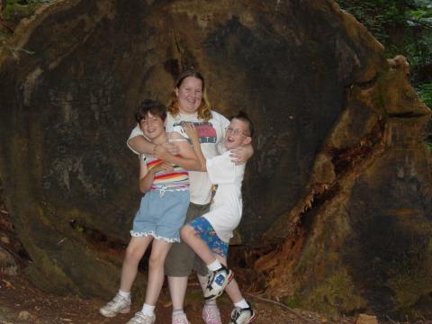 In front of another fallen Redwood tree