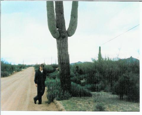 Eddie Presley standing by a Cactus in Scottsdale AZ.