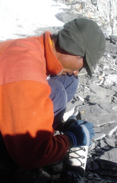 Getting my crampon put on before the ice glacier