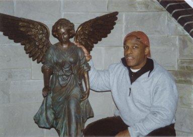Frank & angel statue at Ron's river home