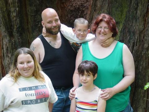 Standing in a Redwood  tree in Calif.