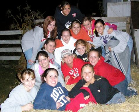 Ashleigh & college dance team on hay rack ride