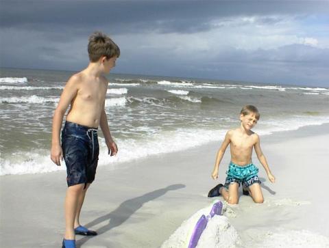 Curtis and Kenny on a beach in Fl