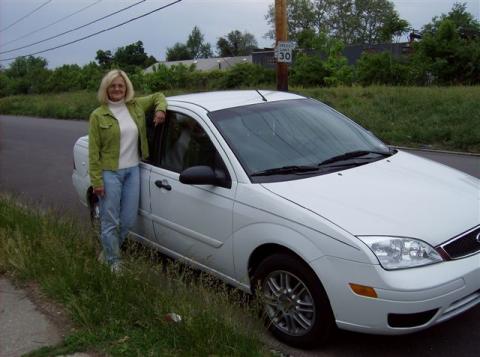 Betty beside her car, May 07