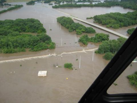 water spilling over the levee