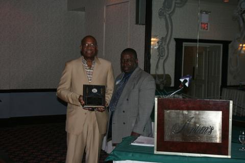 Coach Granby Receiving Honoray Award from Dennis Gober