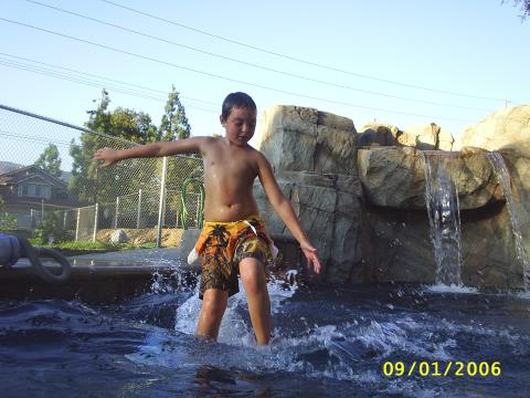 Joey playing in pool